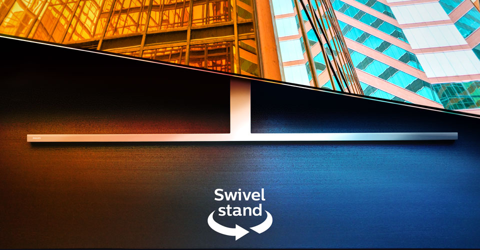 En Philips Ambilight-TV p&aring; et dreibart stativ som viser to fargerike arkitektoniske scener, med en pil og tekst som indikerer dreiefunksjonen